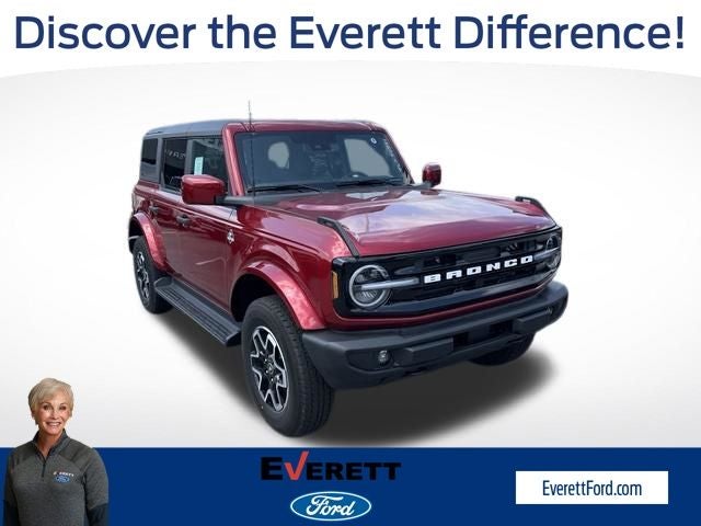 2026 Ford Bronco Outer Banks in Ruby Red Metallic Tinted Clearcoat — front three-quarter view