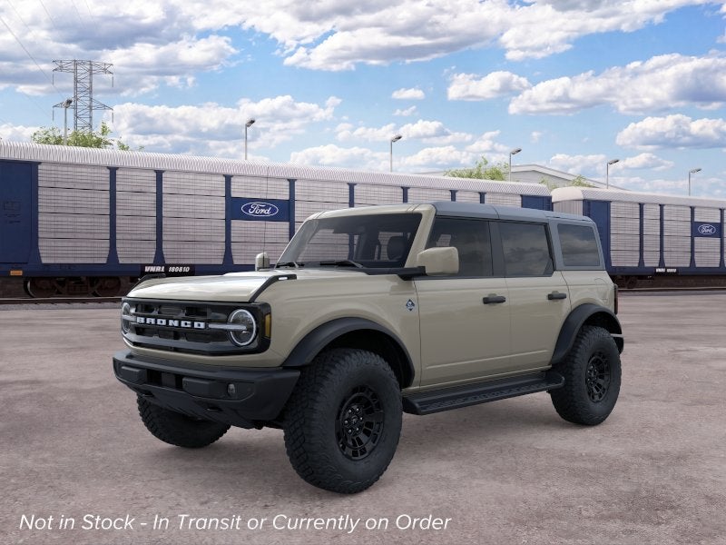 2026 Ford Bronco Outer Banks in Desert Sand — front three-quarter view