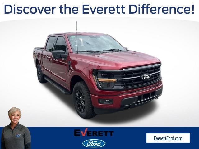 2026 Ford F-150 XLT in Ruby Red Metallic Tinted Clearcoat — front three-quarter view