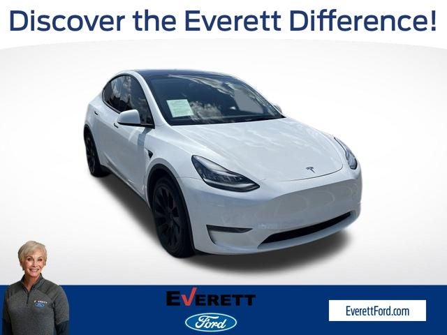 2023 Tesla Model Y Long Range in Pearl White Multi-Coat — front three-quarter view